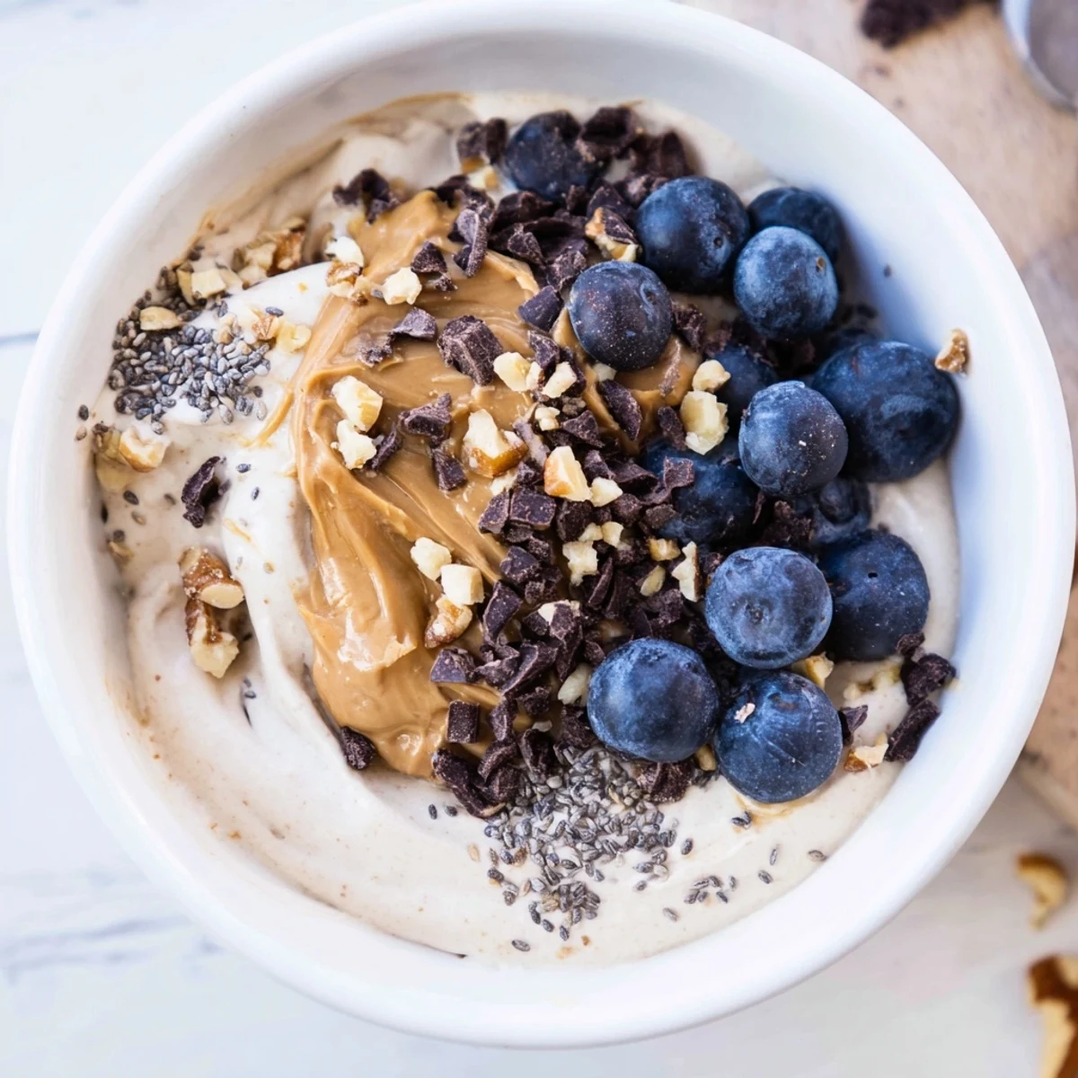 A delicious, homemade Protein Ice Cream Bowl with chocolate chips, ready for a guilt-free dessert.