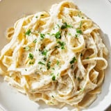 This delicious Cottage Cheese Alfredo Sauce has Parmesan cheese and is sprinkled with fresh parsley.