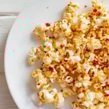 Close-up of fluffy, spiced hot honey butter popcorn, ready to enjoy at your next party.