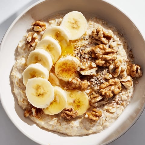 Steaming bowl of Microwave Banana Oats with sliced bananas, ready for a delicious breakfast.
