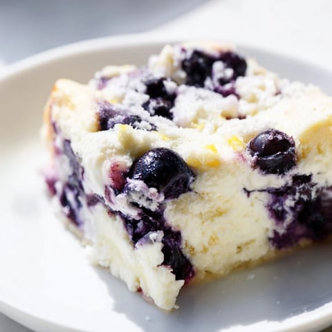Fluffy Blueberry Cottage Cheese Bake, boasting plump blueberries and a golden, baked top.
