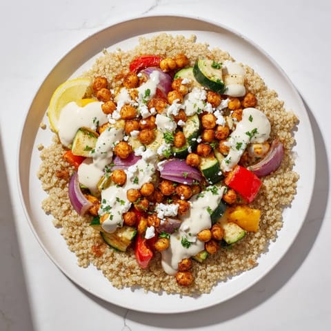 A close-up of a delicious Mediterranean Chickpea and Veggie Grain Bowl, ready to be enjoyed as a meal.