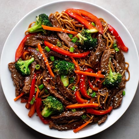 Flavorful Easy Beef Stir-Fry with Lo Mein Noodles showcasing tender beef and vibrant vegetables.