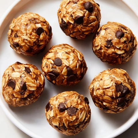 Golden, chewy No-Bake Peanut Butter Energy Balls, a delicious snack with peanut butter aroma.