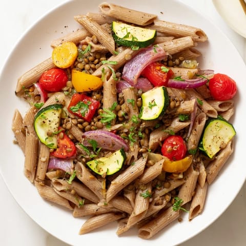 A warm bowl of Lentil Pasta with Vegetables, perfectly seasoned and ready for a hearty meal.