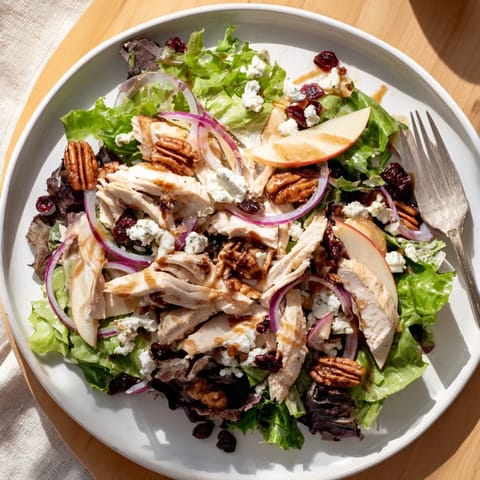 Tender chicken and crisp apples on a bed of mixed greens for a Caramel Apple Chicken Salad, drizzled with caramel-pecan dressing.