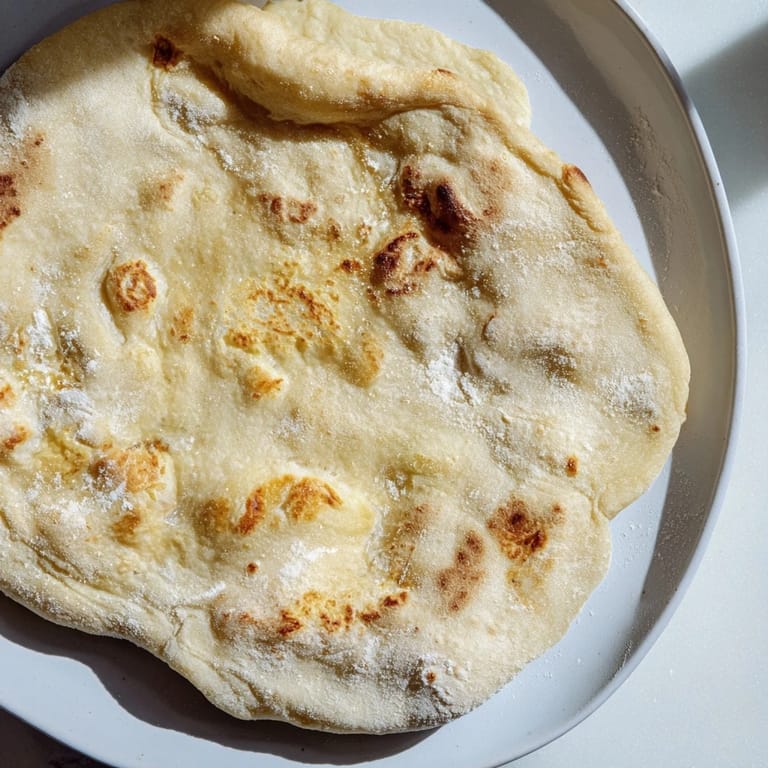Warm, fluffy Three-Ingredient Easy Flatbreads, a simple Mediterranean-inspired meal ready in minutes.