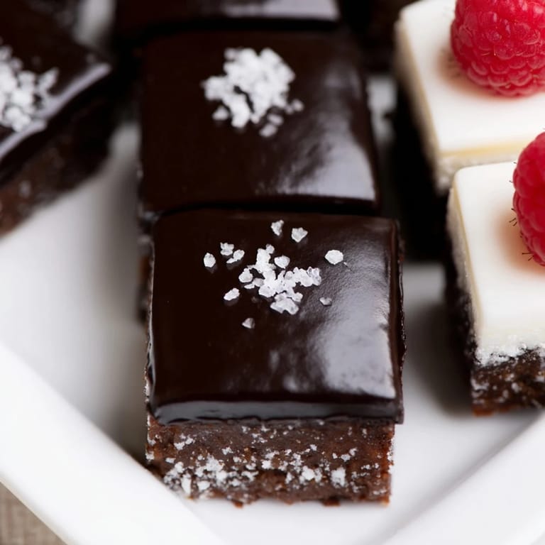 Close up shows Checkerboard Terrace squares with glossy ganache and salted caramel over cookie base.
