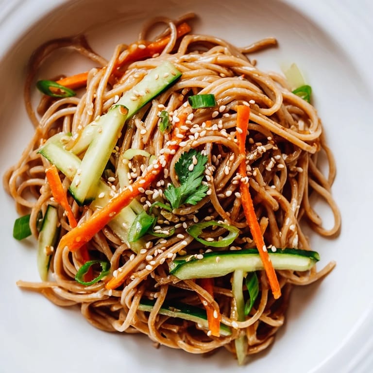 Prepare delicious Chilled Noodle Lunch Cups with sesame-infused noodles, ready for a flavorful lunch.